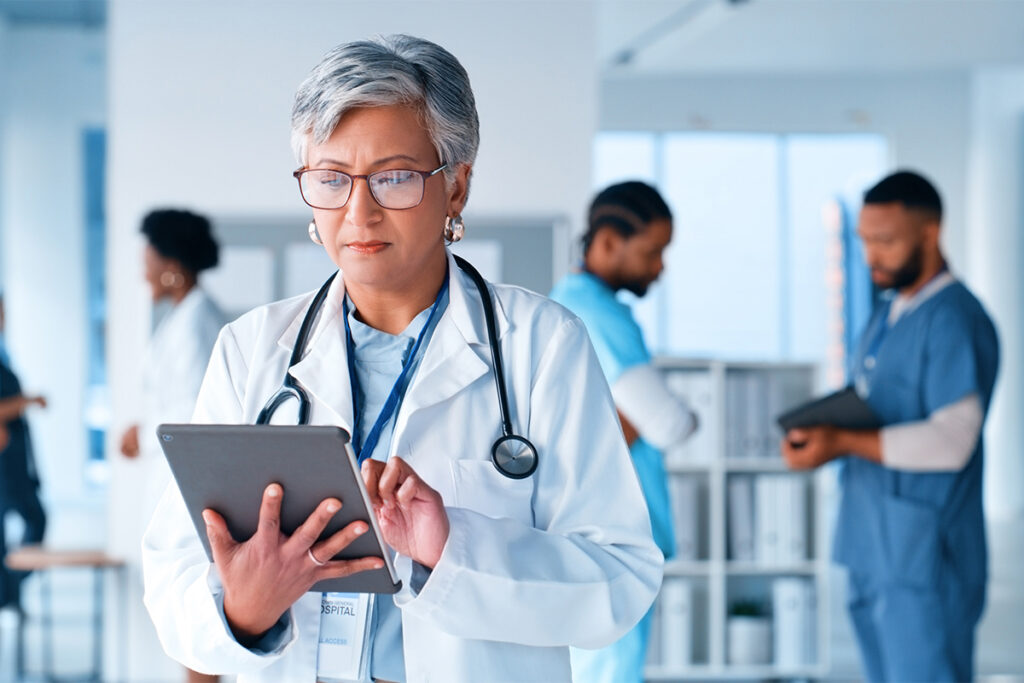 Mature woman, thinking or doctor on tablet at hospital for healthcare questions, research or schedule solution. Digital, app or surgeon brainstorming at clinic for Telehealth problem solving or faq